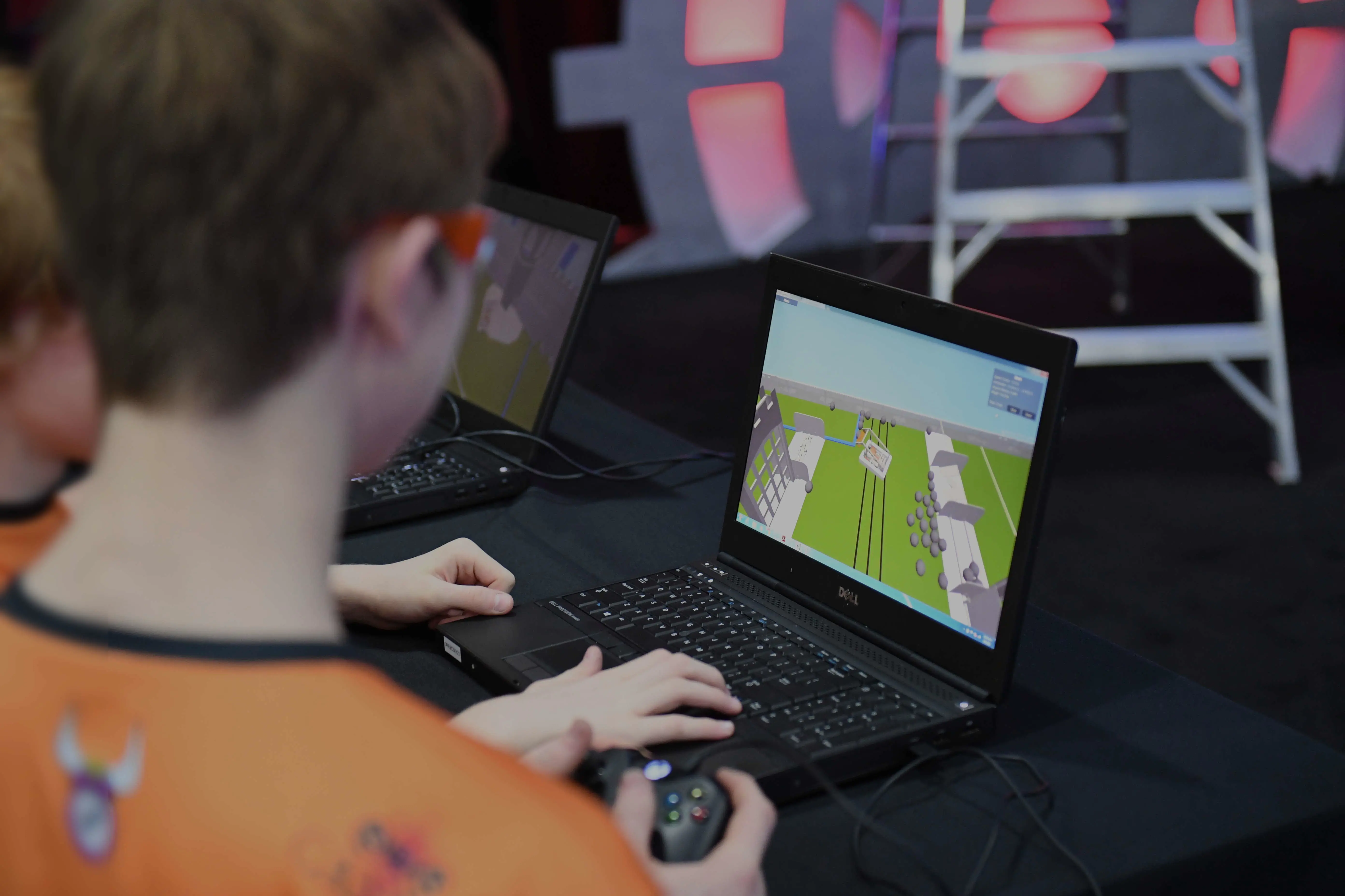 Two students using the synthesis web app on a laptop